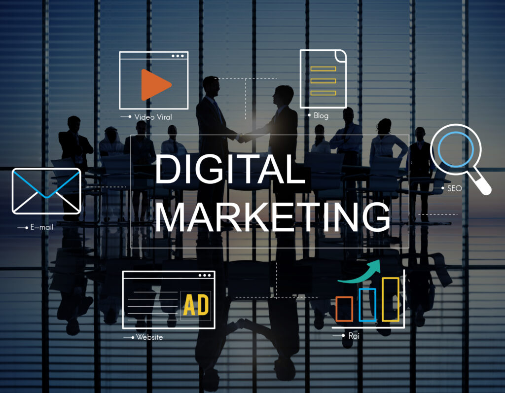 A digital marketing concept image featuring the text 'DIGITAL MARKETING' with icons representing email, video, blog, ad, SEO, and ROI, set against a silhouette of business professionals in a modern office.